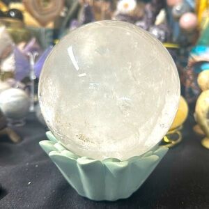 This beautiful 5lb white phantom quartz sphere w/ numerous  rainbows